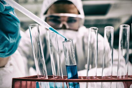 Researcher with test tubes